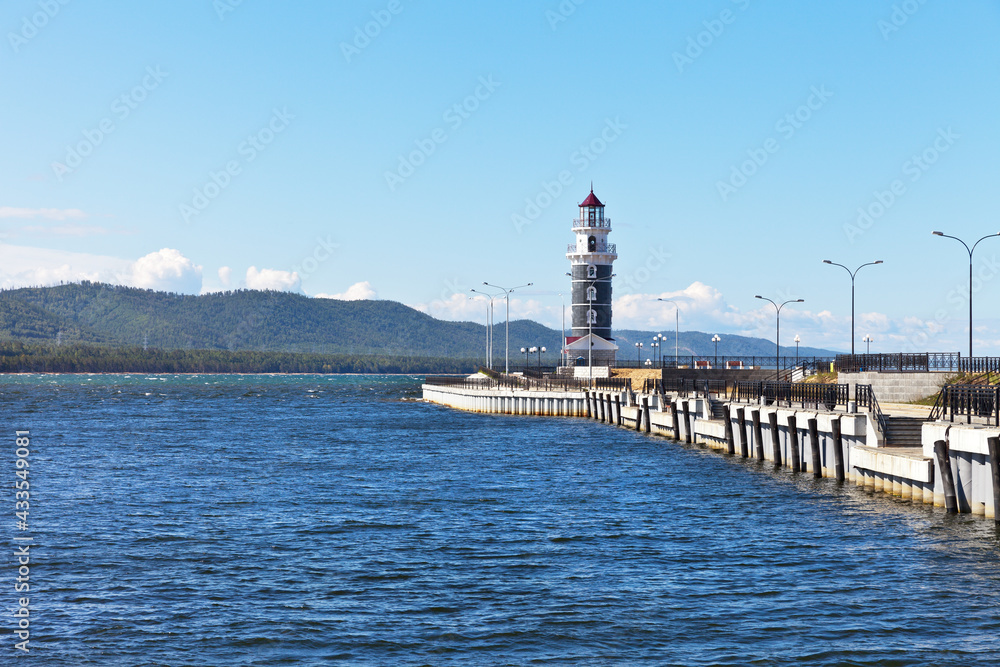 Baika Lake at summer sunny dayl. View from water on lighthouse at the entrance to the 