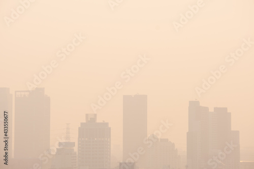 The buildings with yellow smoke in the morning, Smog in the city from PM 2.5 dust, Concept for copy space.