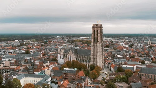 St. Rumbold's Cathedral (Sint Romboutskathedraal), Mechelen, Belgium. Aerial scenic cityscape. Orbiting shot photo
