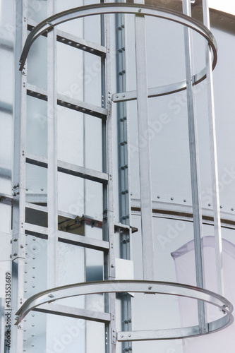 Ladder on silo for storage grain after harvest. Detail of agricultural equipments