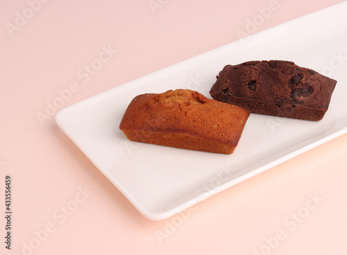 financier cake isolated in pink background