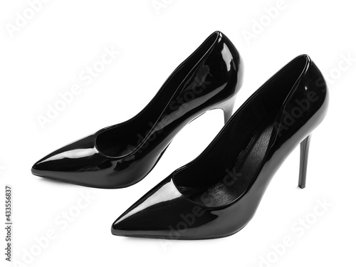 Pair of stylish high heels on white background