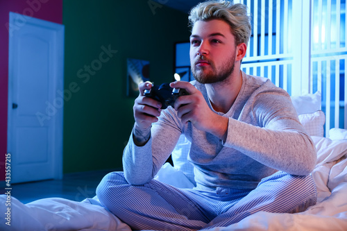 Young man playing video gam...