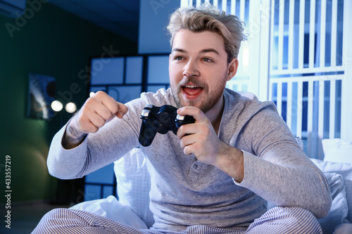 Young man playing video gam...