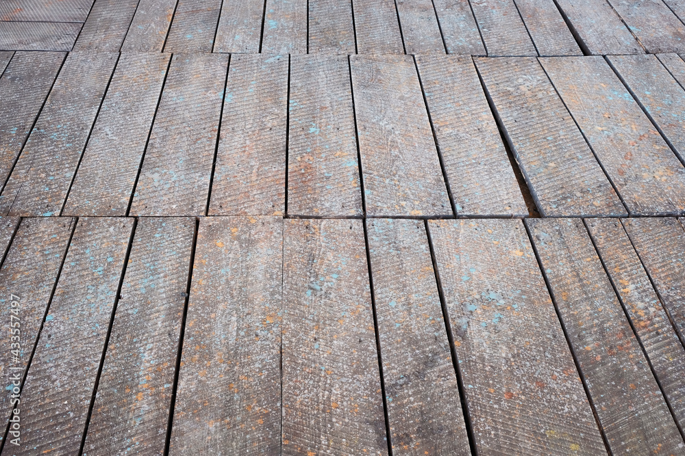 Surface of a grunge wooden floor detail in perspective Surface of a grunge wooden floor detail in perspective