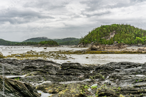Low tide at Parc National du Bic near Rimouski in Bas St Laurent (Quebec, Canada) on a rainy and moody day