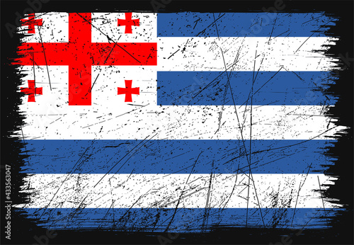 Creative grunge flag of Adjara country. Happy national day of Adjara. Brush flag on shiny black background