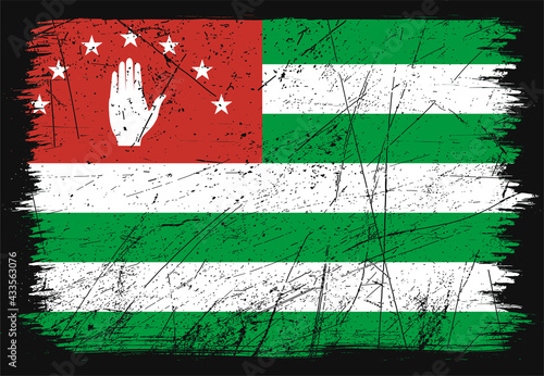 Creative grunge flag of Abkhazia country. Happy independence day of Abkhazia. Brush flag on shiny black background