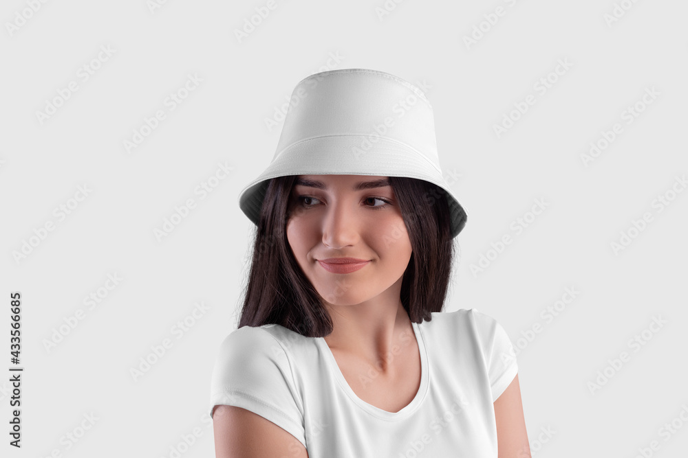 White panama mockup for design on cute dark haired girl isolated on background White panama mockup for design on cute dark haired girl isolated on background