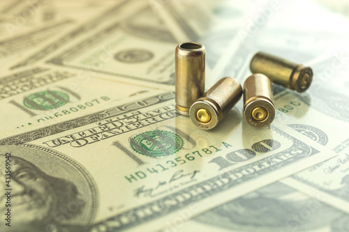Bullet on the dollar background, criminal money and corruption, illegal trading concept