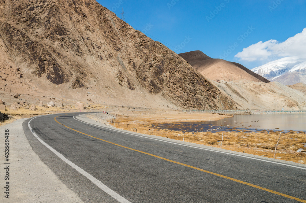 Gobi snow mountains and roads in kashgar, xinjiang, China