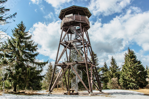 Wooden observation tower called Anna on Anensky Peak in Orlicke Mountains,Czech Republic.Spiral staircase of lookout tower, construction with metal steps and oak platform.Czech tourist place photo