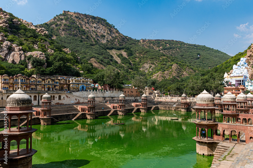 Fototapeta premium Reflection in water of historical buildings commonly known as Chhatris or cenotaphs. This is very pupilar traditional architecture among Rajastan old royal families to respect their loved ones.