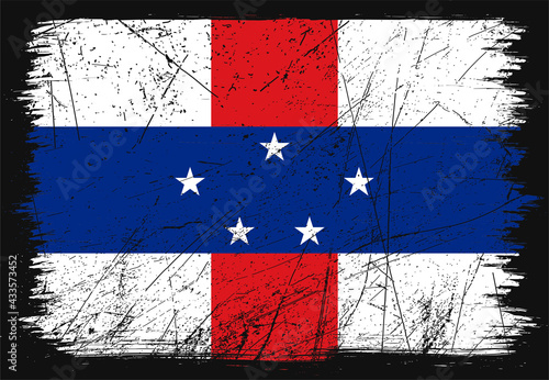 Creative grunge flag of Netherlands Antilles country. Happy national day of Netherlands Antilles. Brush flag on shiny black background