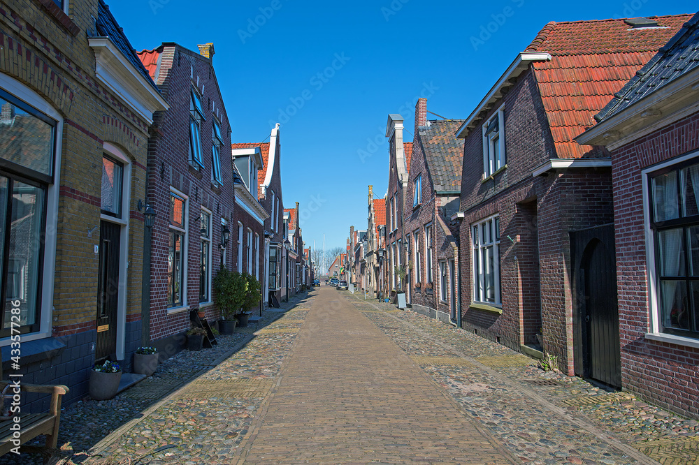 Medieval houses in the streets of Hindeloopen in the Netherlands Medieval houses in the streets of Hindeloopen in the Netherlands