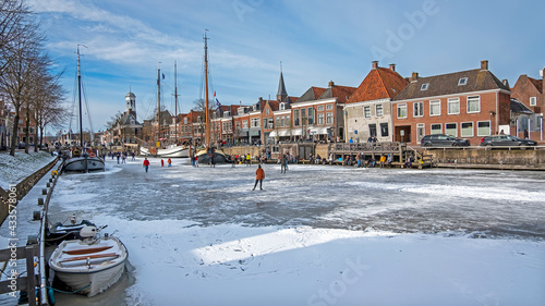 Winter fun on the canals in the city Dokkum in the Netherlands photo