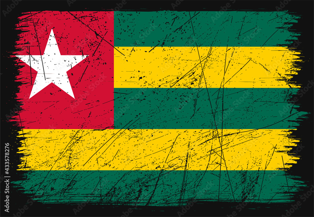 Creative grunge flag of Togo country. Happy independence day of Togo. Brush flag on shiny black background
