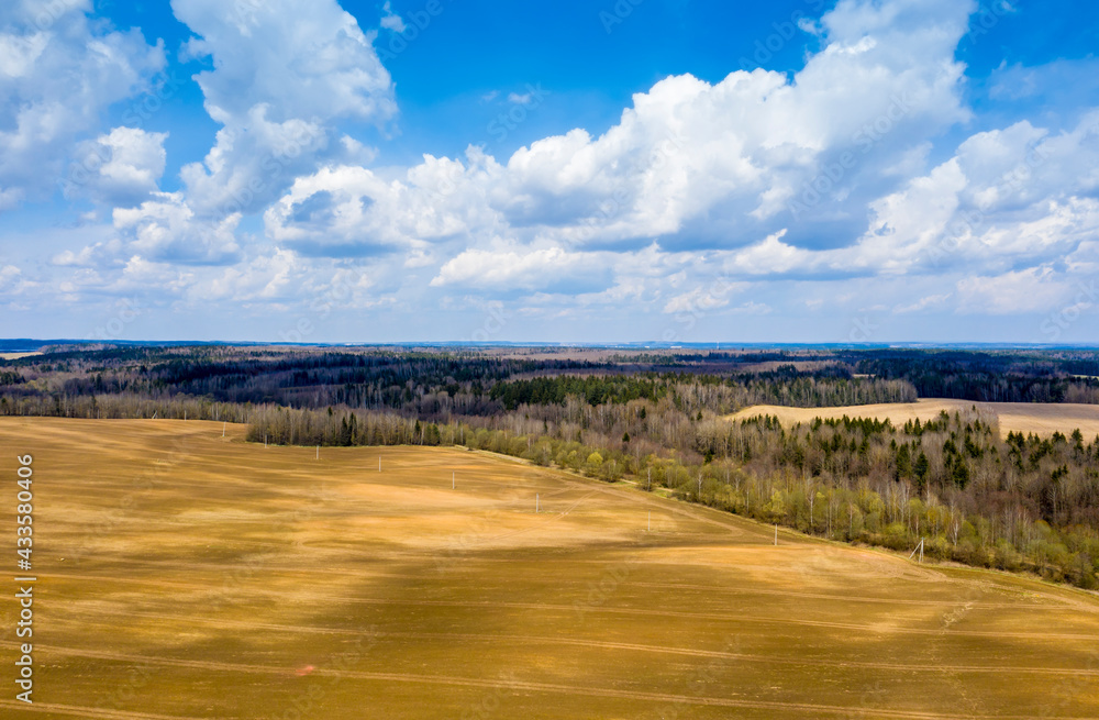 Aerial view of agricultural landscape with fields in spring season.