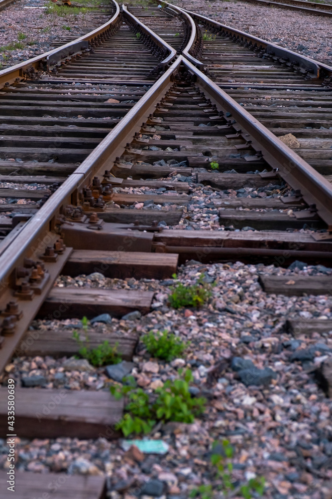 Closeup of an retro style railway track with wooden sleepers. Closeup of an retro style railway track with wooden sleepers.