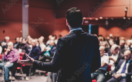 Speaker giving a talk at business conference meeting.