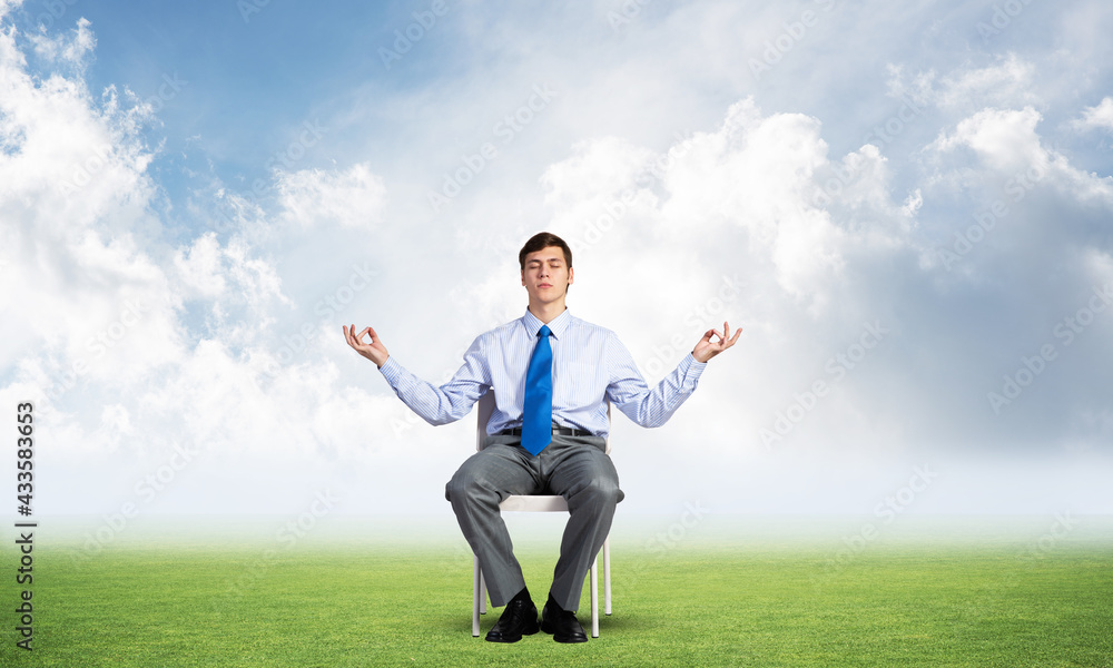 businessman meditates on office chair businessman meditates on office chair