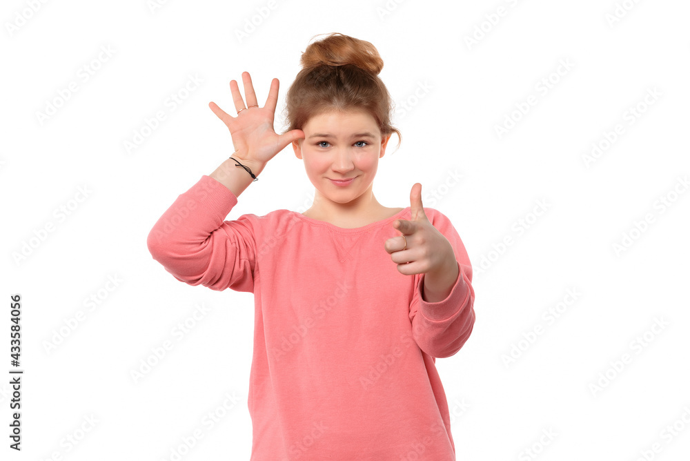 puzzled teen girl asking, gesturing are you crazy, out of your mind puzzled teen girl asking, gesturing are you crazy, out of your mind