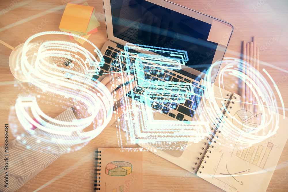 Multi exposure of man's hands typing over computer keyboard and SEO hologram drawing. Top view. Search optimization concept. Multi exposure of man's hands typing over computer keyboard and SEO hologram drawing. Top view. Search optimization concept.