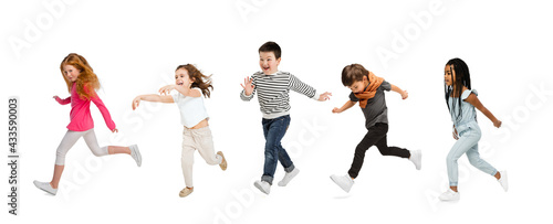 Art collage made of portraits of little and happy kids isolated on white studio background. Human emotions, facial expression concept © master1305