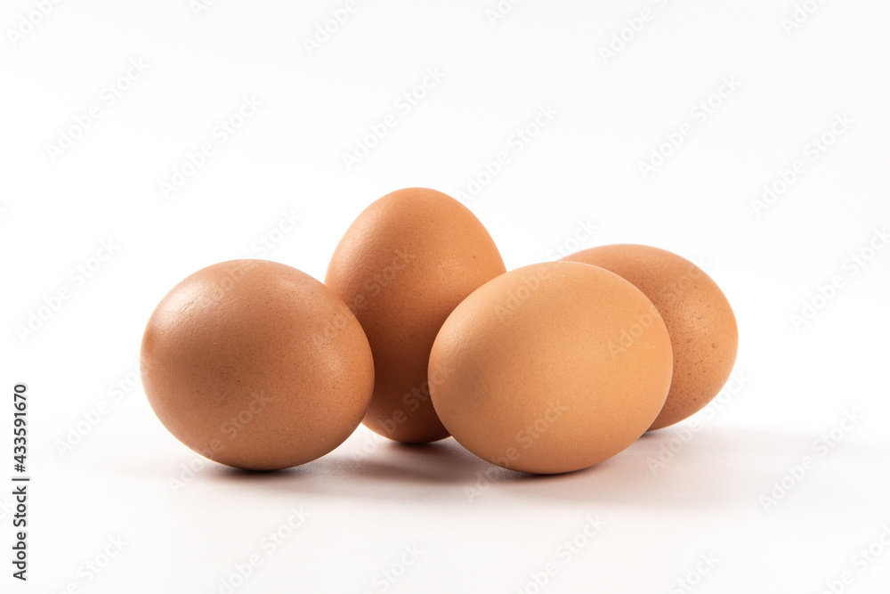Raw brown chicken eggs on white background Raw brown chicken eggs on white background