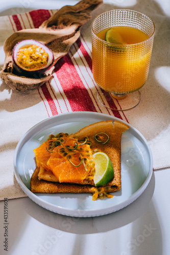 Crepes Or Thin Pancakes With Delicious passion fruit and lime.
