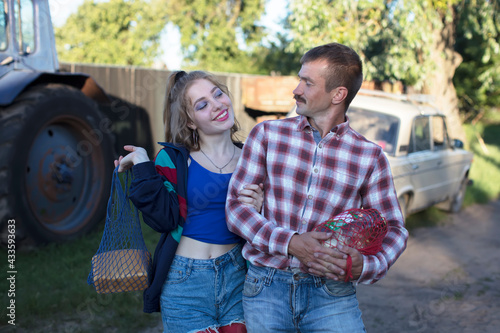 Funny country couple man and woman flirting with each other.