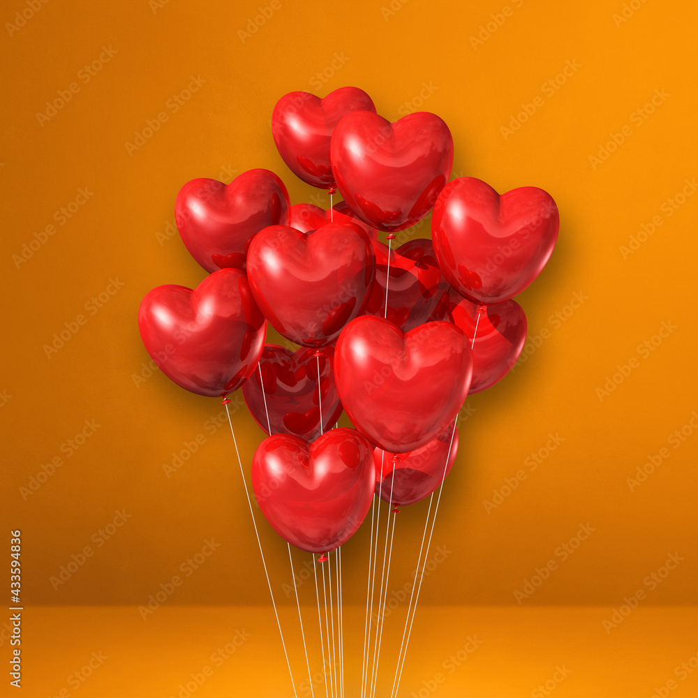 Red heart shape balloons bunch on orange wall background