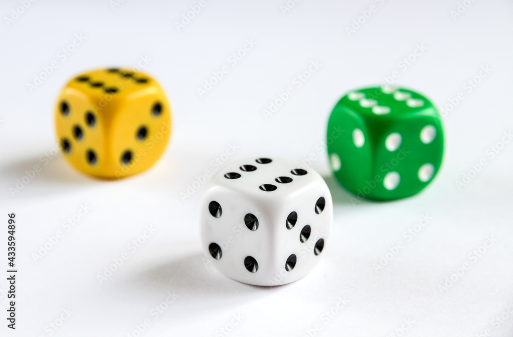 Three colorful dices isolated on white background Three colorful dices isolated on white background