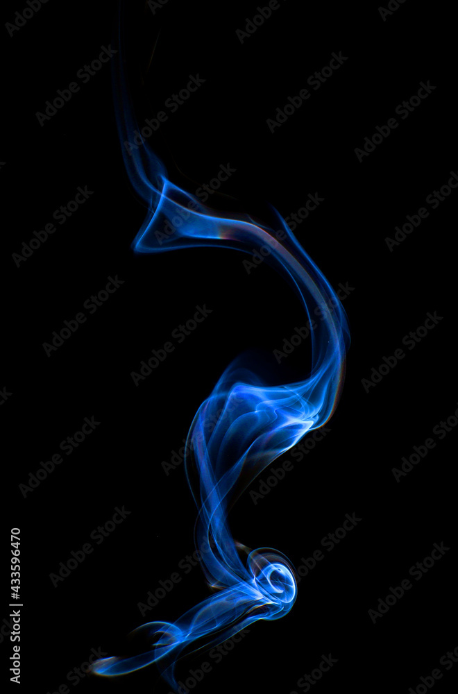 Swirling motion of blue smoke or fog group, abstract line isolated on black background Swirling motion of blue smoke or fog group, abstract line isolated on black background
