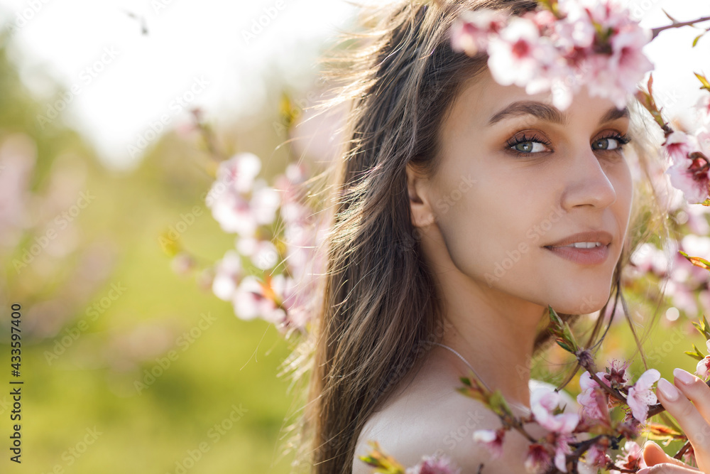 Portrait of a happy young woman in peach field Portrait of a happy young woman in peach field