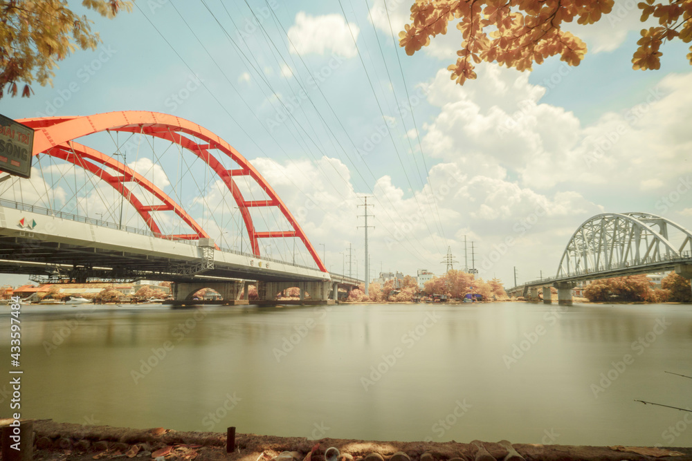 Obraz premium This is a landscape photo infrared. The picture was taken in Ho Chi Minh City, 13/4/2021. Content about architecture of Binh Loi bridge. This is a famous bridge in Ho Chi Minh city.