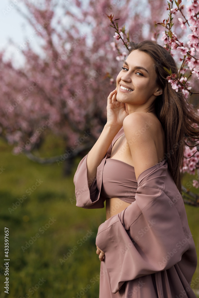 beautiful young woman outdoor in bloom field beautiful young woman outdoor in bloom field