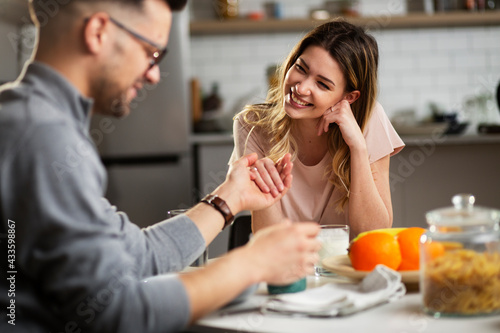Wallpaper Mural Beautiful young girl enjoying in breakfast with her boyfriend. Loving couple drinking coffee in the kitchen. Torontodigital.ca