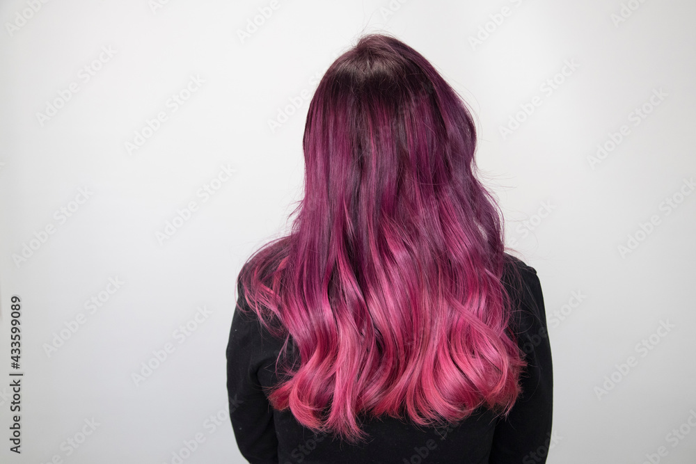 Rear view of dark hair with pink dye. Soft focus Stock Photo