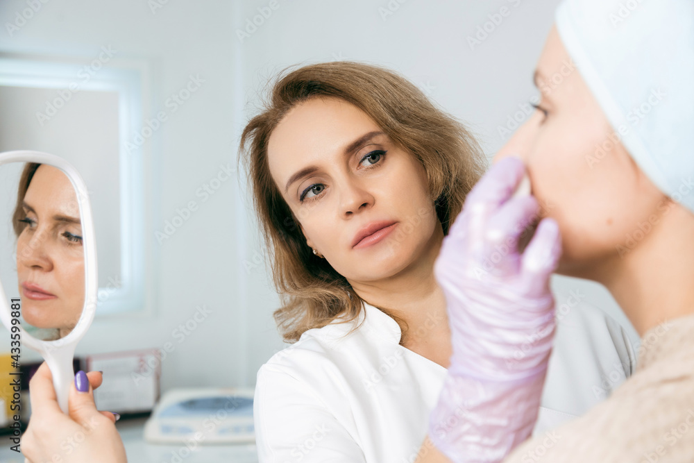 Woman doing rejuvenation procedure, Non-surgical face lifting. lifting ultrasonic. Facelift Woman doing rejuvenation procedure, Non-surgical face lifting. lifting ultrasonic. Facelift