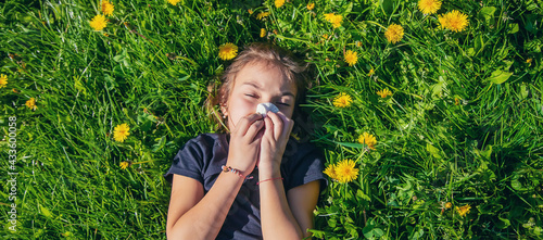 The child is allergic to flowers. Selective focus.
