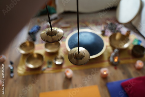 Cymbal close up with sound healing set up in the background.