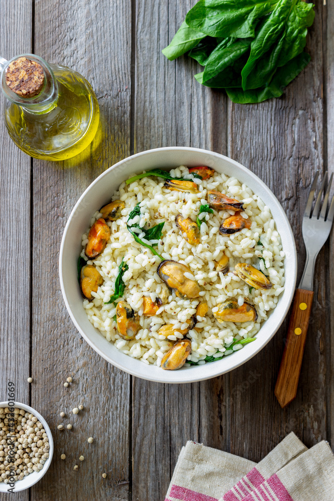 Risotto with mussels and spinach. Healthy food. Vegetarian food. Risotto with mussels and spinach. Healthy food. Vegetarian food.