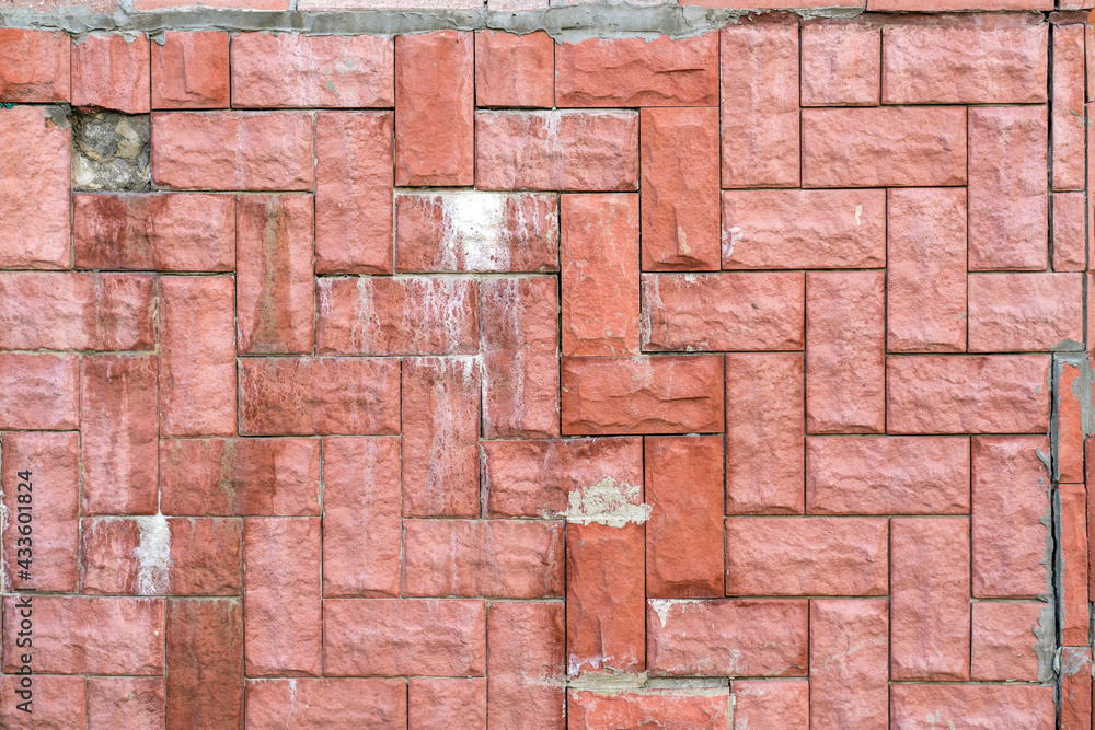 Poorly laid red tiles with traces of cement Poorly laid red tiles with traces of cement