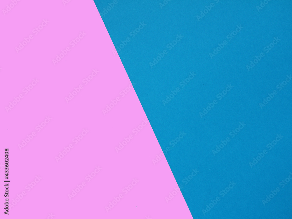 Bright background half blue and pink background. Two colors. Multicolored background. Textured blank blue and pink sheet of paper with copy space for design.