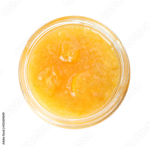 Delicious kumquat jam in glass jar isolated on white, top view