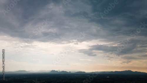 Panorama view  yellow dark sunset sky and clouds in the mountain valley background.