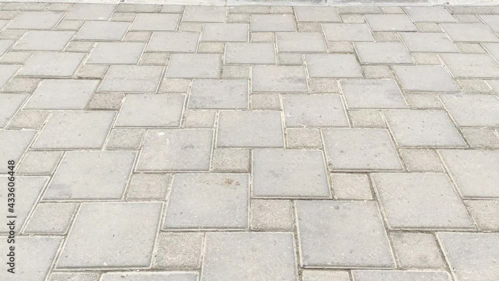 Legs in a tracksuit walk by on the sidewalk. High quality 4k footage Legs in a tracksuit walk by on the sidewalk. High quality 4k footage