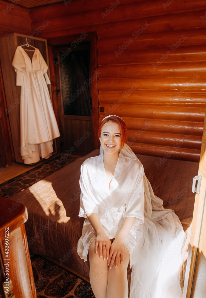 Boudoir Bride's morning. Amazing red-haired girl in her wedding day. Luxurious bride in a beautiful lace robe Boudoir Bride's morning. Amazing red-haired girl in her wedding day. Luxurious bride in a beautiful lace robe