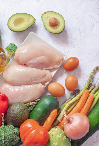 Wallpaper Mural Fresh raw chicken fillet and vegetables prepared for cooking Torontodigital.ca
